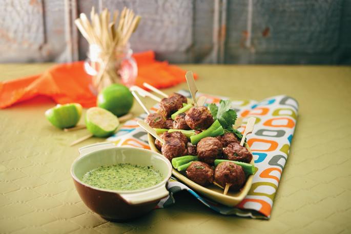 PORK BALLS with Nam Jim ½ cup chopped coriander 6 cloves garlic, crushed 4 long green chillies, finely chopped 4 spring onions, finely chopped 3 cup vegetable oil Juice of 2 limes 2 tablespoons fish