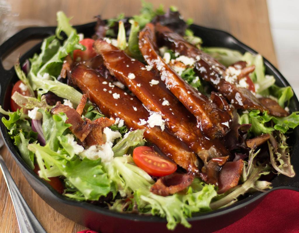 GRILLED CHICKEN CAESAR 10.49 Caesar tossed greens topped with lemon pepper or blackened grilled chicken breast, Asiago cheese, tomatoes, croutons and lemon.. BACON, LETTUCE & TOMATO 9.