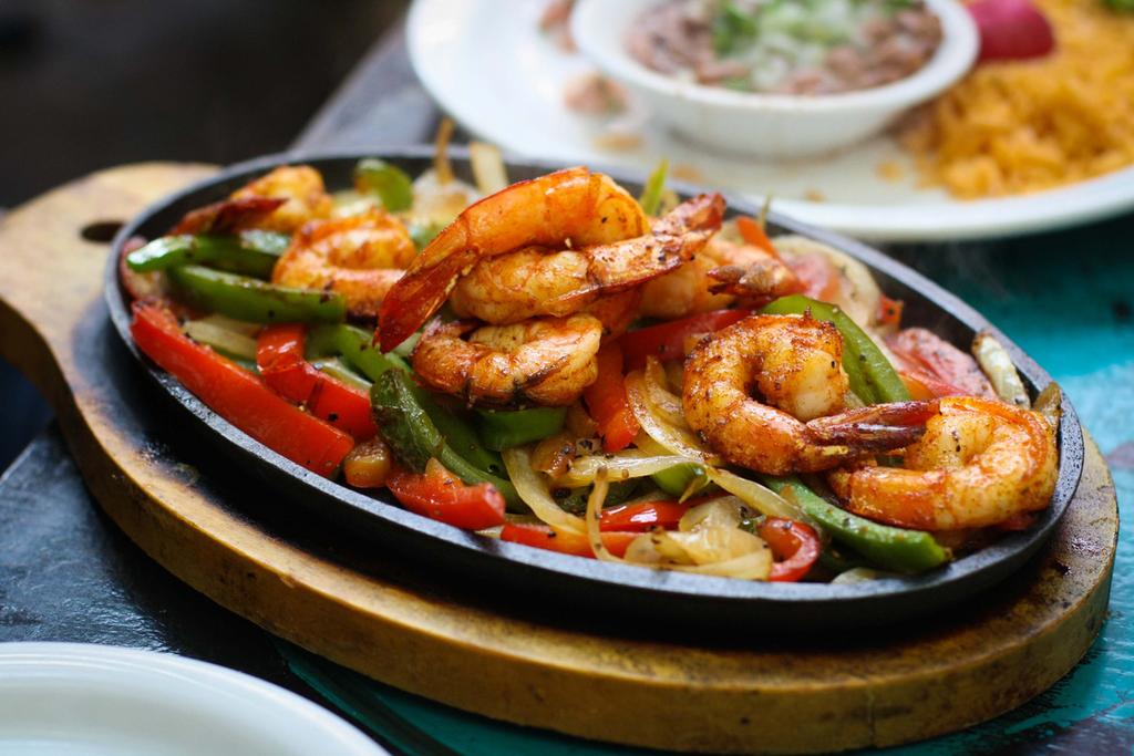 French Fries (C7) FAJITAS FOR ONE (C8) FAJITAS FOR TWO Serves two, Choice of chicken, beef, or mixed Served with all the fixings $1895 (C9) FAJITA TRIO Shrimp + Chicken + Steak Served with all the