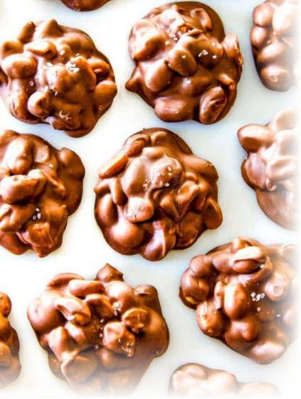 Mint Chocolate Clusters 1 cup semi-sweet chocolate chips 1 teaspoon mint extract 1/2 cup pecan pieces 2/3 cup Cheerios 1/3 cup M & M's mini baking bits (or raisins) Microwave chocolate chips in a