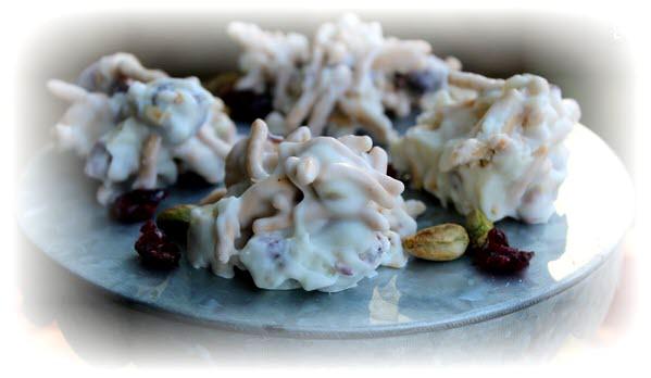 No Bake Cranberry Clusters 2 cups sugar 1/4 cup butter 1/2 cup milk 3 cups oats 1 teaspoon vanilla 1-1/4 cup white chocolate 3/4 cup macadamia nuts chopped 1/4 cup cranberries, chopped In a large