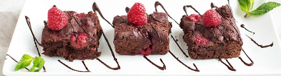 Rasberry Truffle Brownies In a large mixing bowl, vigorously mix together the jam, sweetener, and applesauce. Stir in the vanilla, almond extract, and the melted chocolate.