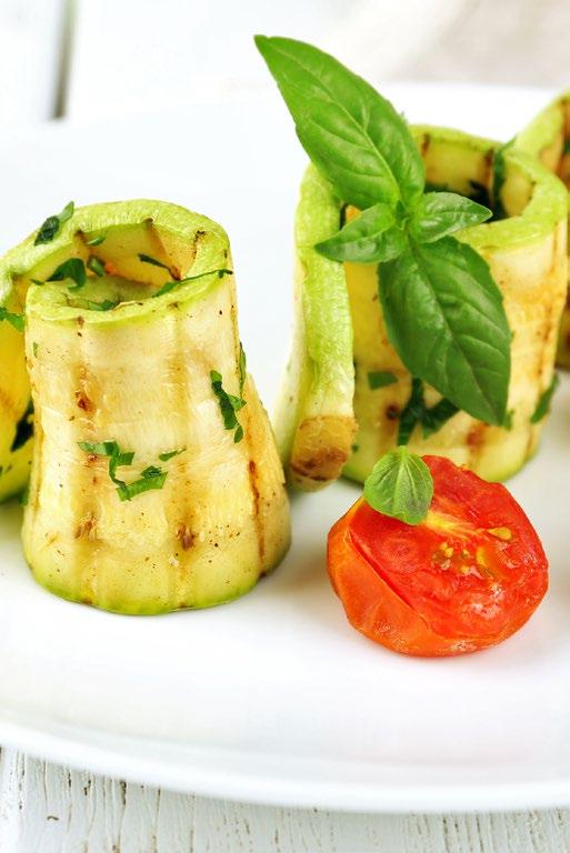 COURGETTE ROLLS VEGETARIAN 1/2 courgette, sliced into strips using a vegetable peeler 1 ball of mozzarella, sliced thinly 6 cherry tomatoes, halved Olive oil SERVES 4-6 Salt & pepper Place one cherry