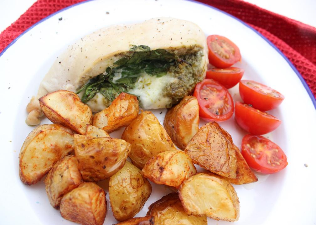 Mozzarella, tomato & pesto chicken a drizzle of olive oil to grease tray 300g potatoes, cut into small chunks 3/4 tsp paprika 2 x 170g fresh chicken breasts 1 tbsp green pesto 25g fresh spinach