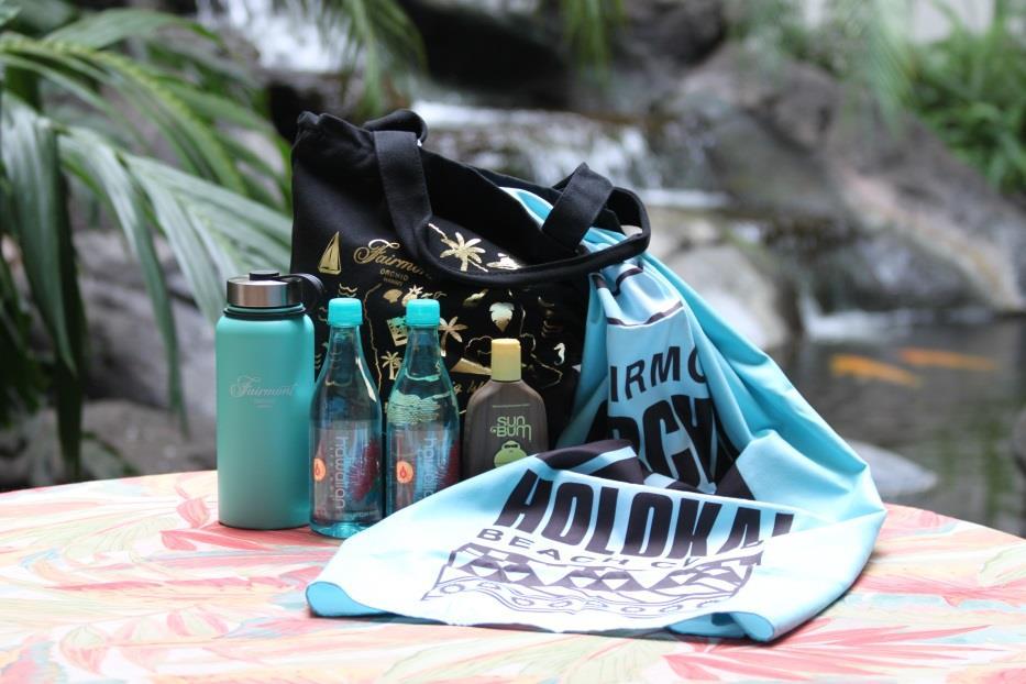 Includes a Fairmont hot/cold flask, Bare sunscreen, a Fairmont beach bag, and a micro towel.