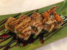 uramaki style topped with snow crab salad, drizzled with sesame
