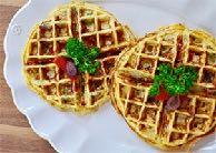 Omelette Waffles Yields 4 servings Butter 6 eggs ¼ cup milk ¼ cup feta cheese, crumbled ½ cup red bell pepper, thinly sliced ¼ cup Kalamata olives, seeded and chopped ¼ cup fresh broccoli, chopped ¼