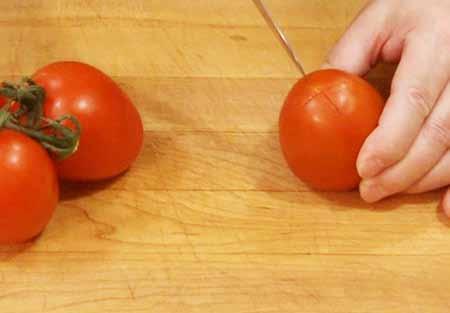5 4 Cut an X in the bottom of each tomato.