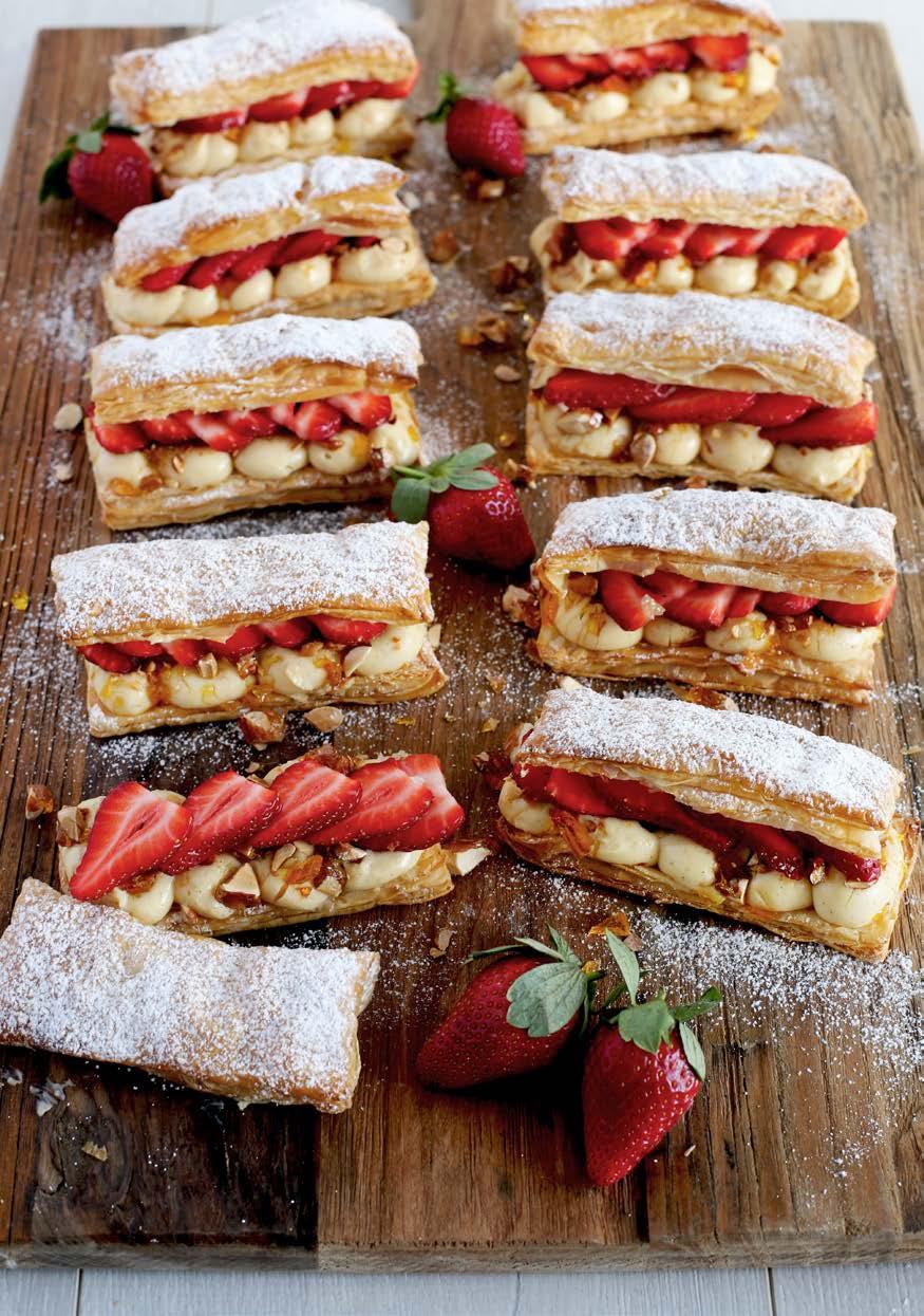 Strawberry & honey millefeuille with almond praline Medium 40 mins Makes 12 375 gm puff pastry sheet 1 egg, beaten for egg wash 350 gm strawberries, sliced Almond praline 1 cup (220 gm) caster sugar