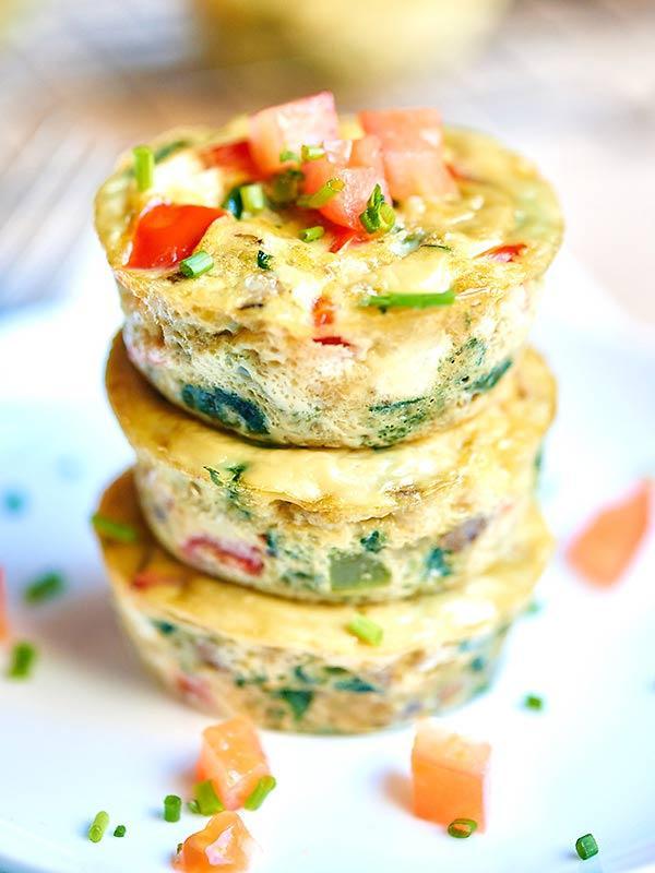 Breakfast: Option 1: Veggie Egg Muffins Serves: 12 Serving Size: 2 egg muffins - 4 Large eggs - 1 Tbs low fat cottage cheese (optional) - salt - pepper - garlic powder - 1 cup chopped spinach - 1 cup