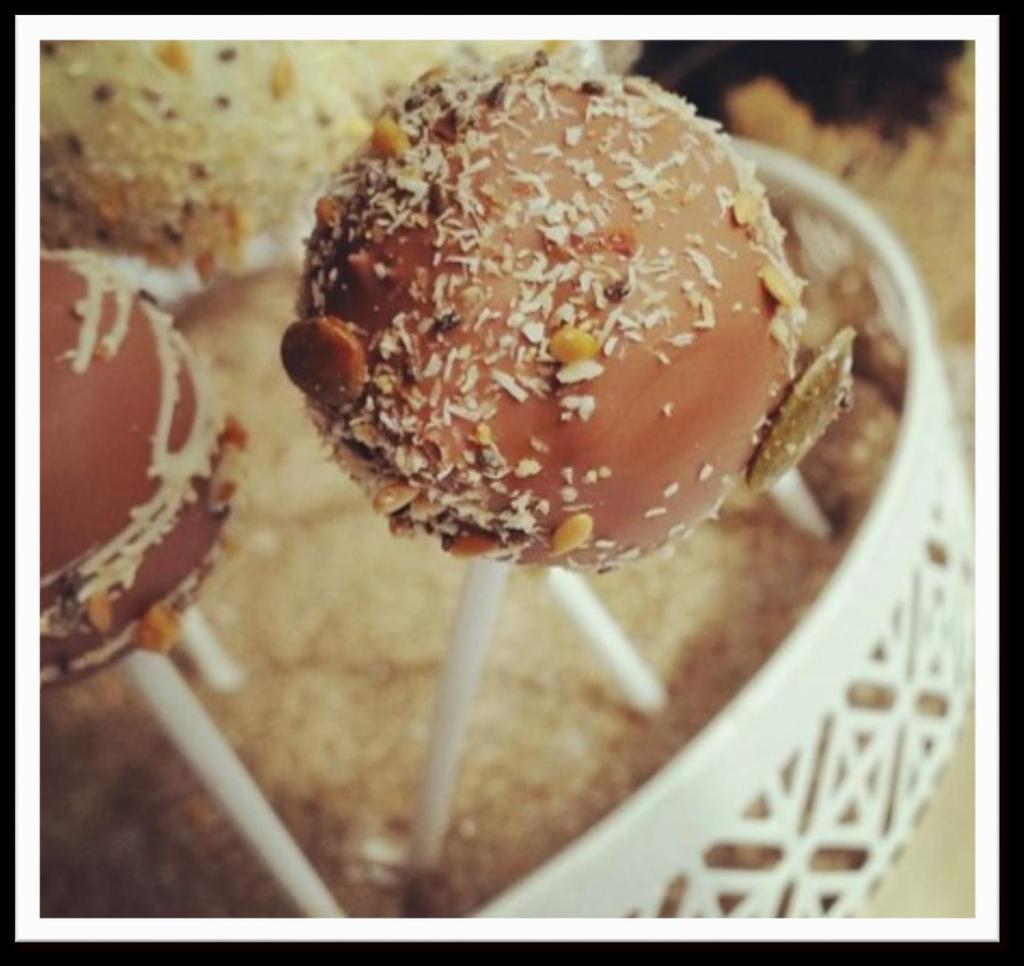 Cake Pops Decadent balls of cake dipped in chocolate and sprinkled with nuts. Guiltfree indulgence.