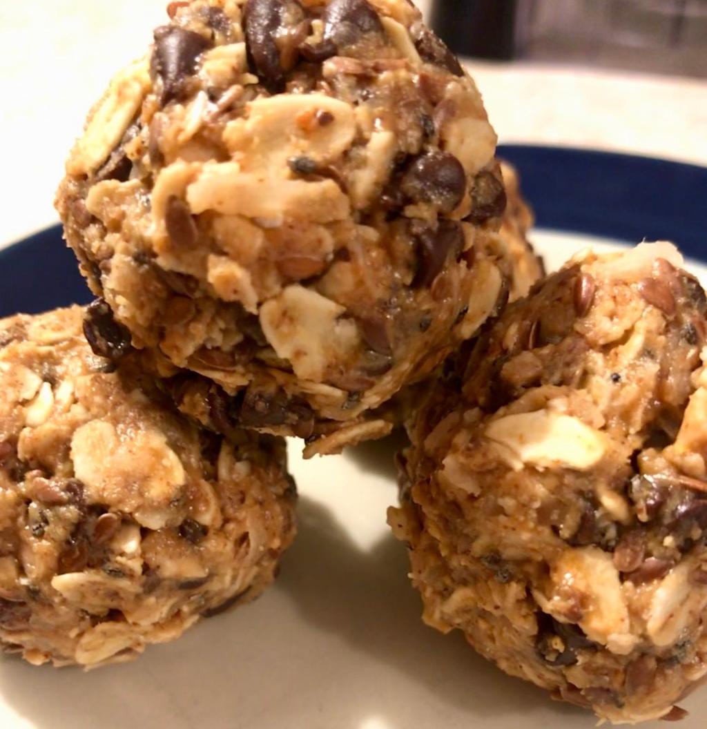 Energy bites 1 1/2 cups old fashioned oats 1/4 cup flaxseed 2 tsp chia seeds 2/3 cup toasted coconut 1/3 cup organic peanut butter 1/2 cup organic almond butter Sprinkle of cinnamon 1/2 cup miniature