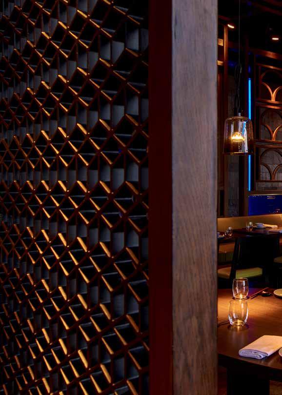 THE CAGE The restaurant s main dining room is separated by intricate carved wooden screens and latticing that echoes the rich and glamorous interiors of the London flagship restaurant.