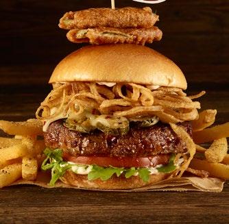 HICKORY BARBECUE BACON CHEESEBURGER Basted with hickory barbecue sauce and topped with caramelized onions, cheddar cheese, smoked bacon, crisp lettuce and vine-ripened tomato.* $19.50 ƒ34.