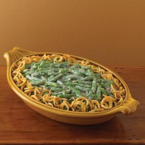 Green Bean Casserole 2 cans (10.5 ounces) Cream of Mushroom Soup 1 ½ cups milk 1/8 teaspoon ground black pepper 60 ounces green beans (drained) 2 3/4 ounces French Fried Onions 1. Preheat oven to 350.
