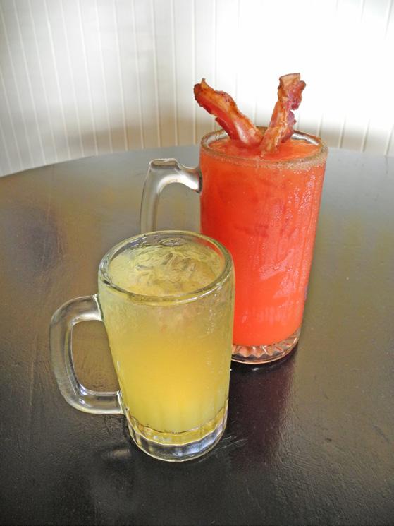 BACON BLOODY MARY Made with bacon flavored vodka and bloody mary mix. Garnished with 2 strips of bacon. Yum!
