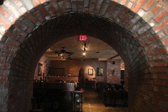 When Aris Galanis purchased the building next door he was able to expand the kitchen and dining room. The archway leads patrons from the bar and lobby into the main dining room.