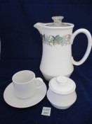 White cups and saucers, 2 spare cups and a sugar bowl and lid.