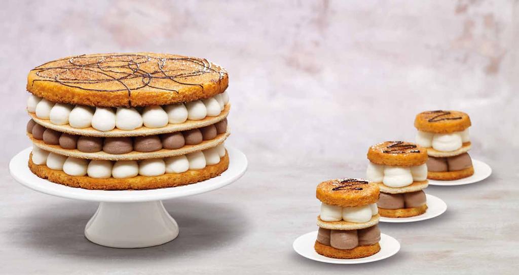 Spain San Marcos Cake Spain s traditional holiday cake is made of light sponge, chocolate creme and whipped cream.