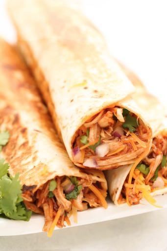 DAY 1 GLUTEN FREE- BBQ CHICKEN BURRITOS M A I N D I S H Serves: 6 Prep Time: 10 Minutes Cook Time: 5 Minutes 2 cups cooked chicken, shredded 3 cups shredded Colby Jack cheese (divided) 1/4 cup red
