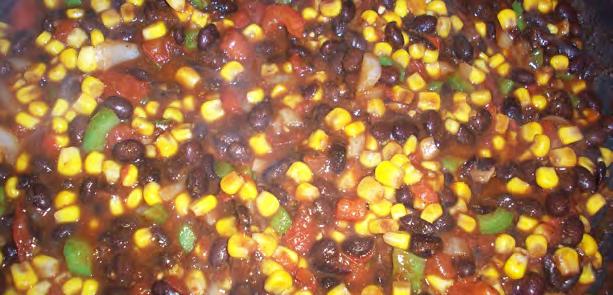 Black Bean Nacho Dish Serves: 8 Serving Size: 1 cup Vegetable spray or oil 1 medium zucchini*, chopped (~1 cup) 1 medium green* or red bell pepper*, chopped (~1/2 cup) 1 cup corn* (frozen or canned