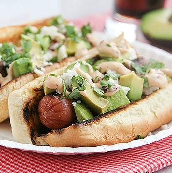 Mexican Hot Dogs 1/2 cup mayonnaise 7 oz can chipotle peppers in adobo sauce 4 beef hot dogs 4 hot dog buns 1/3 cup crumbled cotija* cheese 1 diced avocado fresh cilantro bunch, chopped *can