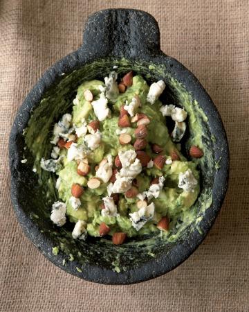Almond and Blue Cheese Guacamole 2 Tablespoons white onion, chopped 1 Tablespoon serrano chile with seeds 1 teaspoon kosher salt 1/4 cup chopped cilantro 1 Tablespoon lime juice 2 avocados 1/4 cup