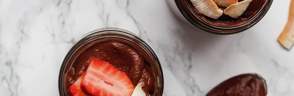 NSK Sweet Potato Chocolate Pudding 45 minutes Sweet Potato (medium, sliced in half lengthwise) Unsweetened Almond Milk Cacao Powder Pitted Dates Vanilla Extract Strawberries (sliced) Unsweetened