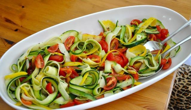Salads & Wrap Recipes Zucchini Ribbon Salad (4 Servings) 3 organic zucchini ½ cup organic cherry tomatoes, quartered 2 Tablespoons olive oil 1 clove garlic, crushed Juice from ½ a lemon 1 teaspoon