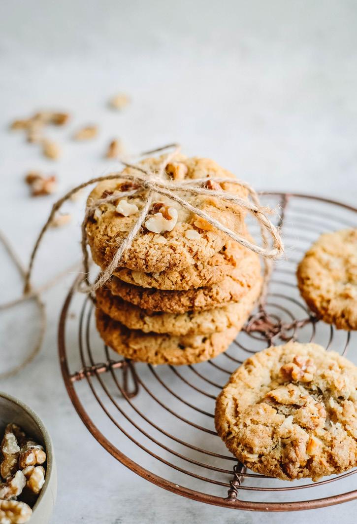 ANZAC EXCLUSIVE Walnut ANZAC Biscuits PREP: 30 minutes COOK: 20 minutes MAKES: 35-40 45g (½ cup) rolled oats 50g (½ cup) desiccated coconut 120g (1 cup) plain flour, sifted 170g (¾ cup) caster sugar