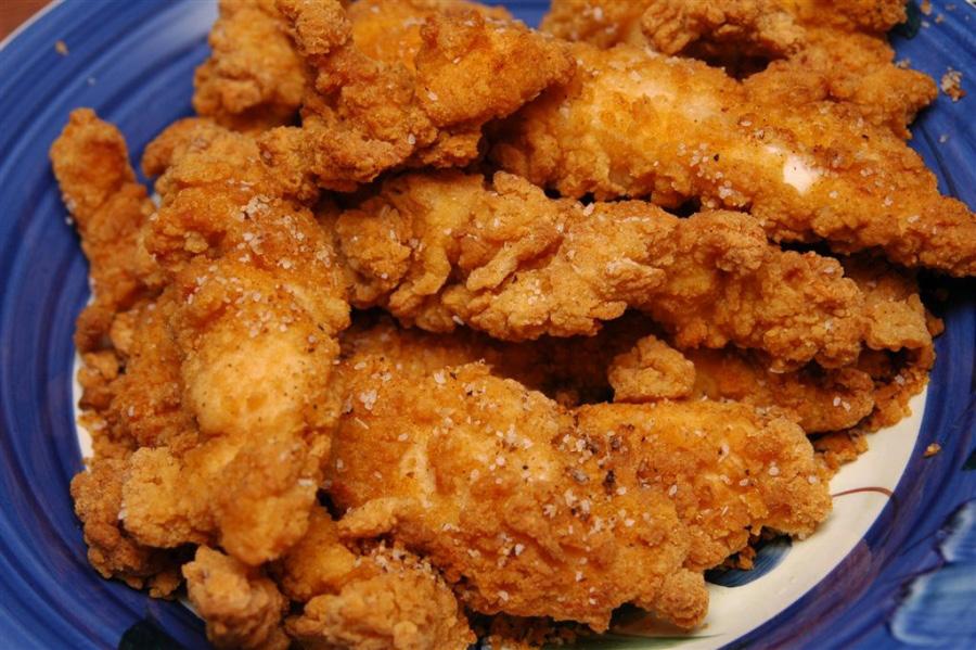 SOUTHERN STYLE FRIED CHICKEN 2 full chickens (3 pounds each) cut into 8 serving pieces 1 quart buttermilk 11/2 tablespoons cayenne pepper 2 cups all-purpose flour 1/2 cup plain bread crumbs 2