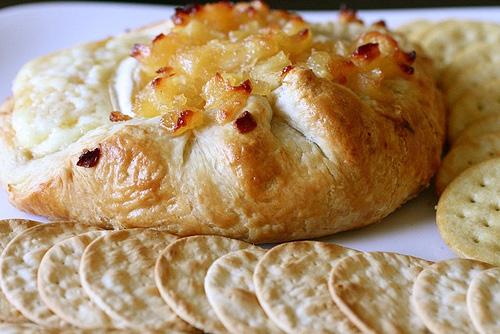 BAKED BRIE w/ Apple Compote 1 tablespoon unsalted butter 2 Golden Delicious apples, peeled, cored and cut into1/2-inch dice 1/4 cup sugar 1/8 tsp.
