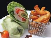 CHICKEN CAESAR WRAP Grilled sliced chicken tossed in Caesar dressing and romaine lettuce wrapped in a flour or spinach tortilla.