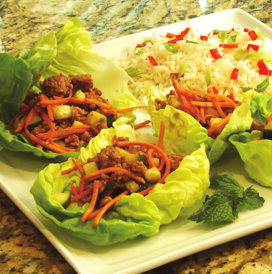 Asian Lettuce Wraps makes 6 servings 1-1/2 pounds ground veal 3/4 cup peanut sauce 2 cups chopped seeded cucumber 1/2 cup shredded carrot 1/4 cup torn fresh mint 12 large Boston lettuce leaves (about