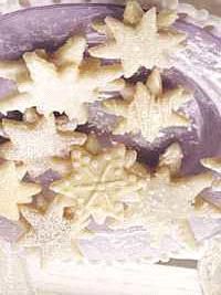 Snowflake Cookies Cookies: 1 c. sugar 3/4 c. margarine, softened 1 tsp. vanilla 2 eggs 2 1/2 c. flour 1 tsp. baking powder 1 tsp. salt Almond Glaze: 3 c. powdered sugar 4 tsp. light corn syrup 1/4 c.