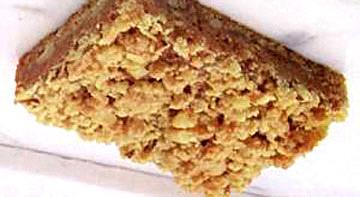 Streusel Caramel Bars 2 c. flour 3/4 c. firmly packed light brown sugar 1 egg, beaten 3/4 c. cold butter or margarine, divided 3/4 c. chopped nuts 24 caramels, unwrapped 1 (14-oz.