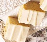 Triple-Vanilla Brownies 1/2 c. butter or margarine 1 2/3 c. white baking chips 1 1/4 c. flour 3/4 c. sugar 1/2 c. chopped nuts 1 tsp. vanilla 1/4 tsp. salt 3 eggs Creamy Vanilla Glaze: 1 1/2 c.