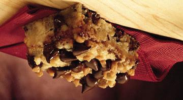 Chocolate Chip Toffee Bars 2 1/2 c. flour 2/3 c. packed light brown sugar 3/4 c. (1 1/2 sticks) butter or margarine 1 egg, slightly beaten 2 c. (12 oz.) pkg. semi-sweet chocolate chips, divided 1 c.