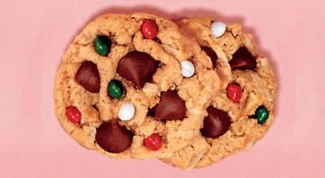 Holiday Treasure Cookies 1 1/2 c. graham cracker crumbs 1/2 c. flour 2 tsp. baking powder 1 (14 oz.) can Eagle Brand milk 1/2 c. butter, softened 1 1/3 c. sweetened coconut flakes 1 3/4 c.