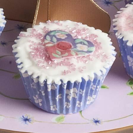 4. Apply to cake using butter icing. 5. Place the butterfly stencil centrally on the cake and using a palette knife, smooth the pink butter icing onto the icing, leaving the butterfly shape. 6.
