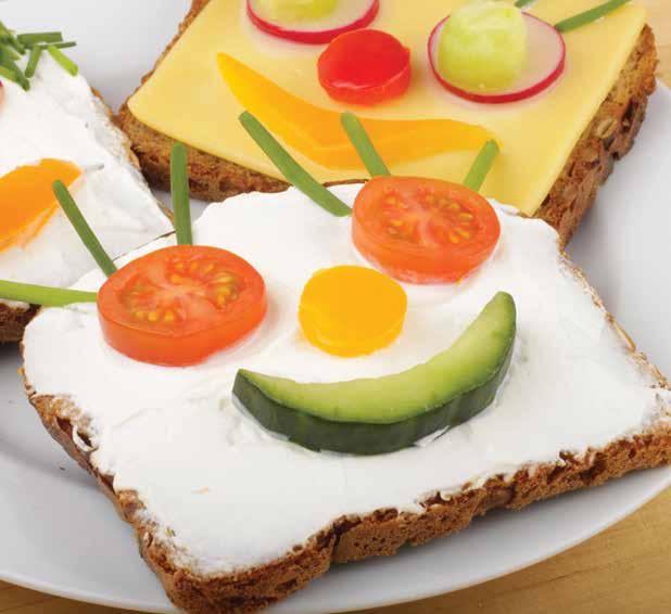 Smiley Toasts Ingredients Wholegrain bread Cream cheese Cherry tomatoes, sliced (for eyes) Carrots, peeled and sliced (for nose) Cucumber, cut into semi-circles (for mouth)