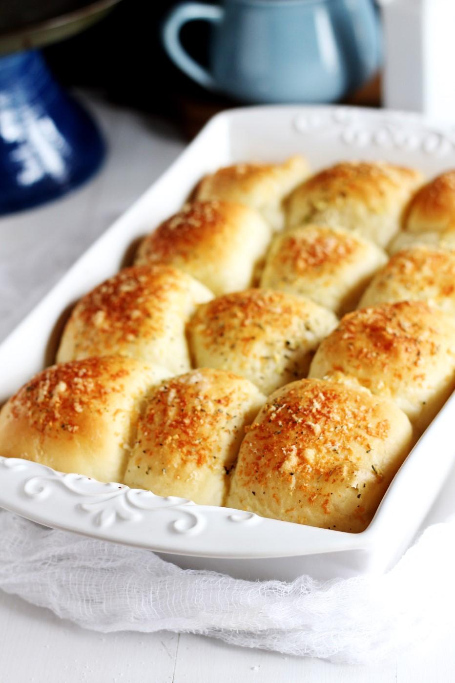 Buttery Garlic Parmesan Rolls ¼ cup warm water, about 110 degrees 2¼ teaspoons (1 pkg) active dry yeast ¾ cup warm milk (I recommend 2%), about 110 degrees 2 tablespoons unsalted butter 1 egg,
