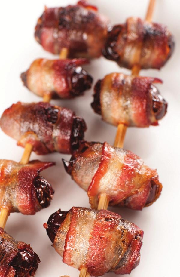 Cut bacon slices in half and wrap each date with piece of bacon. Place wrapped dates on tinfoil or parchment-lined sheet pan. Bake 20 to 25 minutes, or until bacon is crisp.