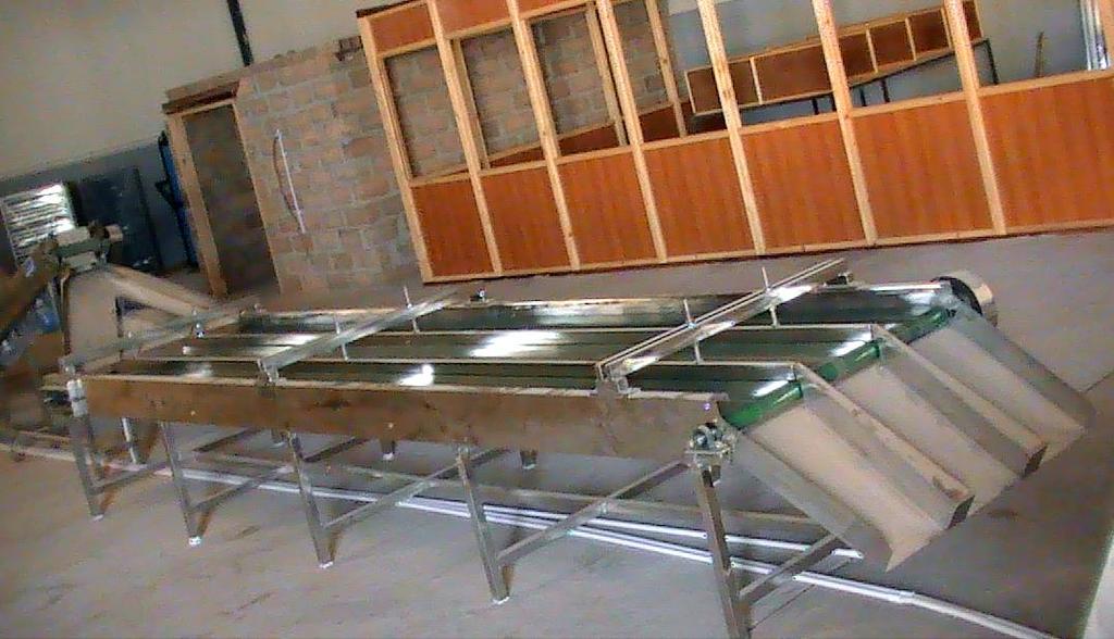 Working Table with slant Conveyor Slant Conveyor is used to feed Peeled Kernels on to