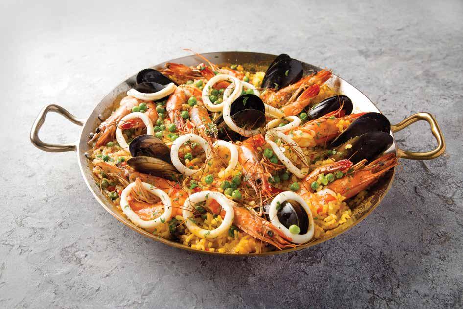 Paella Olive oil Onion (finely chopped) Garlic (finely chopped) Red pepper (chopped) Chicken stock Saffron threads Smoked paprika Bomba (Paella) rice Parsley (leaves picked and chopped) Fresh or