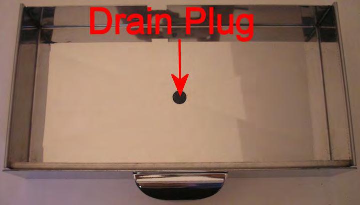 To install the drain kit, pull out the drip tray and then pull the rubber drain plug out of the center of the drip tray and save for future use.