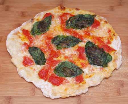 9 6 This is a classic Pizza Magherita, made with lightly cooked chopped tomatoes, buffala mozzarella, and fresh basil leaves.