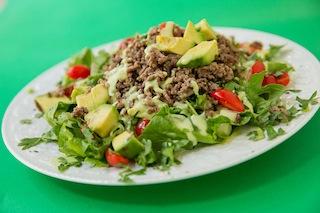 Spicy Mexican Salad with Avocado Cream Recipe 2 Serves 4 1 tablespoon ghee, or use coconut oil 1 medium onion, chopped 3 cloves garlic, minced 1 1/2 pounds ground beef 2 teaspoons sea salt, divided 1