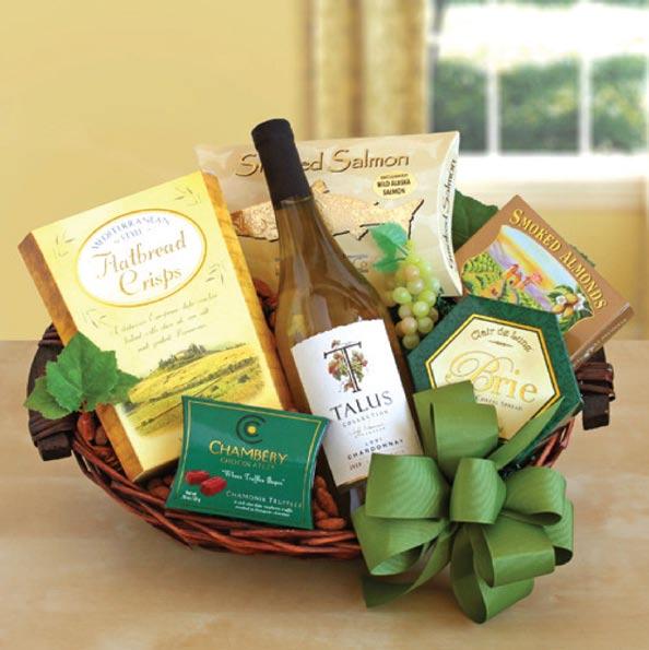 Cheers! Wine and Crackers Gift Basket - $89 A mouthwatering California white wine paired with a smorgasbord of regional gourmet snacks make this gift a favorite among all.