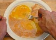 Scramble the egg mixture by stirring vigorously with